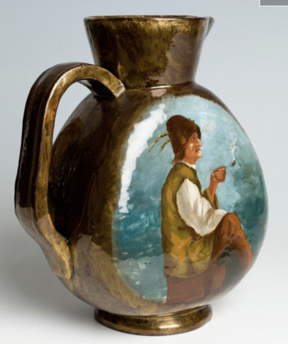 A ceramic pitcher by Emile Galle